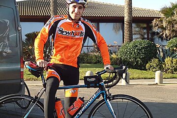 photo of a man with a bicycle