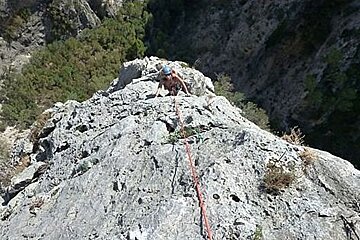 an image of a woman rock climbing