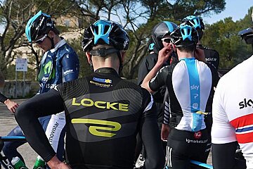 photo of pro cyclists on a road
