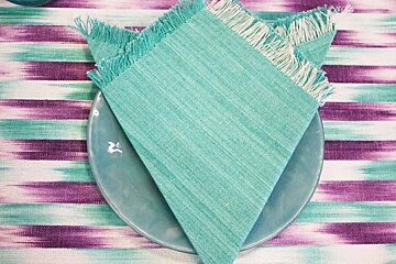 photo of a napkin and table cloth