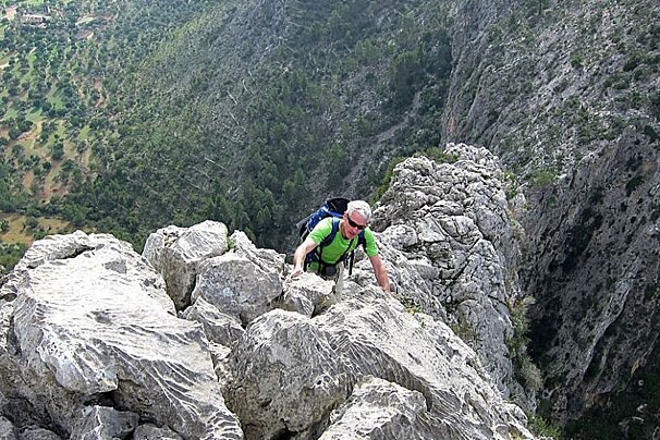 an image of a man rock climbing