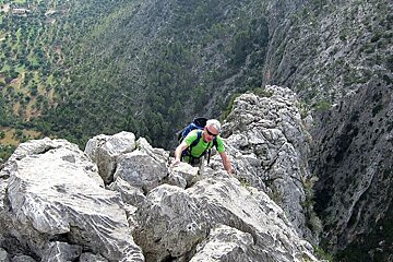 an image of a man rock climbing