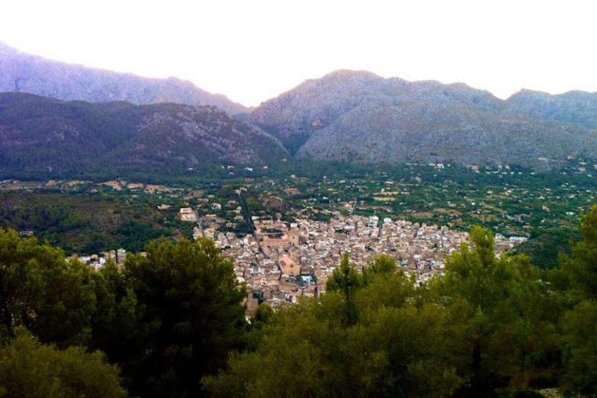 image of a town and hills at dusk