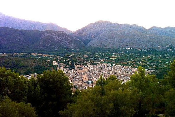 image of a town and hills at dusk