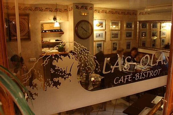 looking through a window into restaurant Las Olas