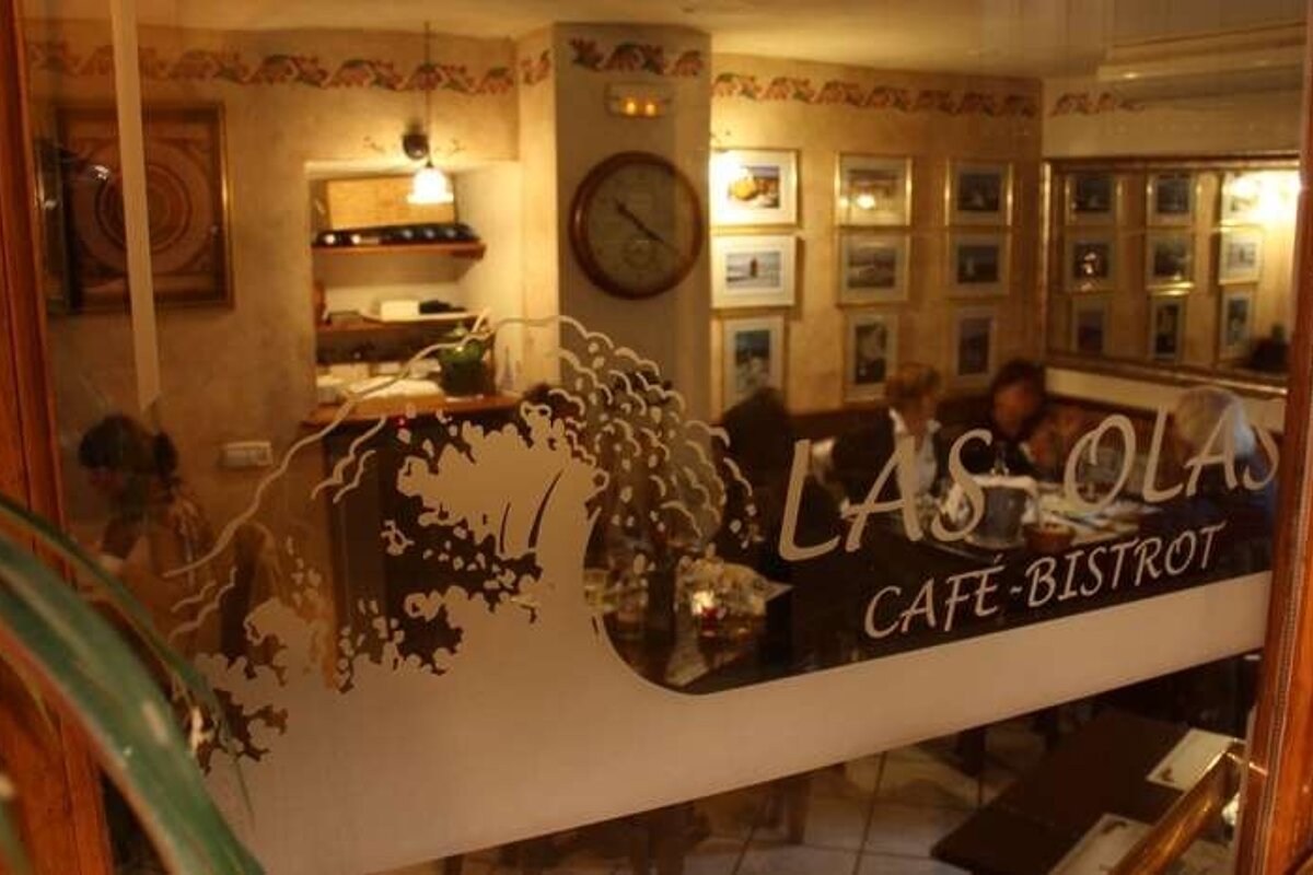 looking through a window into restaurant Las Olas