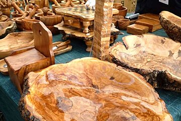 a photo of olive wood platters and bowls
