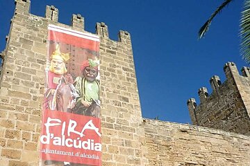a photo of alcudia walls with fair poster