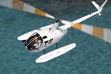 Image of white helicopter over the sea