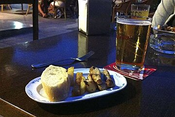 photo of tapas and a drink on a table