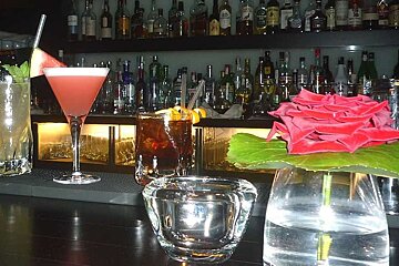 a photo of cocktails in a bar