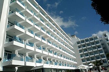 a photo of a hotel front with balconies