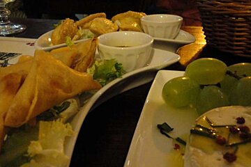 close up of food gapes and samosas