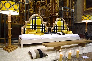 a photo of a sofa in pollencas church alter