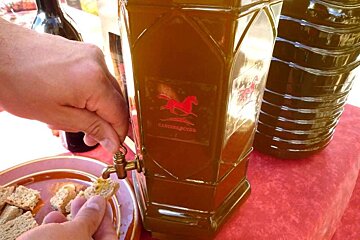 a photo of olive oil tasting on a piece of bread