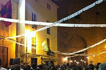 photo of a people in a street party at night