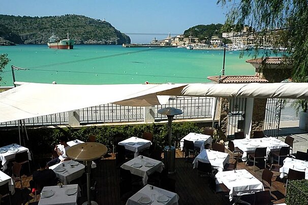 photo of dining terrace and bay with blue sea