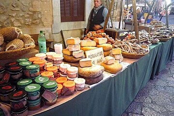 a photo of a cheese stall in pollenca