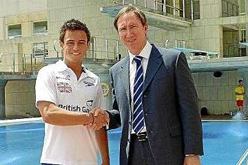 Tom Daley shaking hands with Paul Abrey