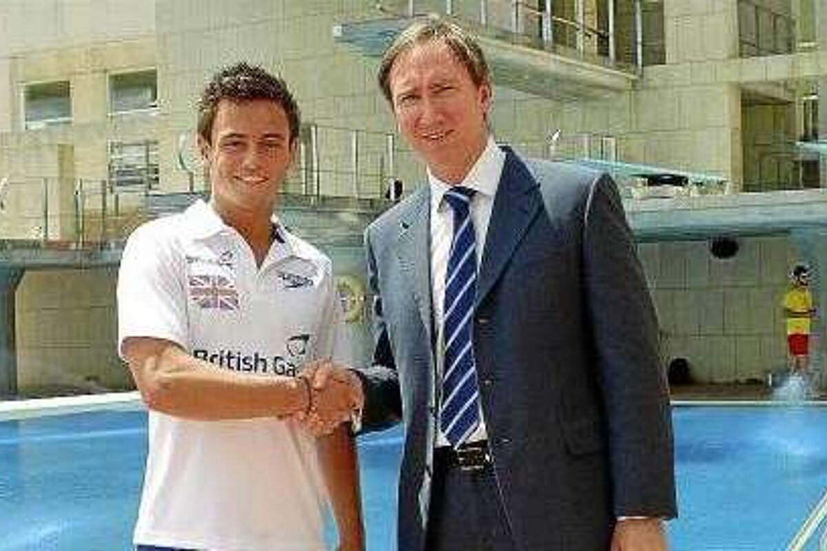 Tom Daley shaking hands with Paul Abrey