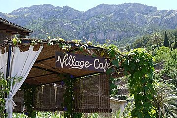photo of a cafe and mountains