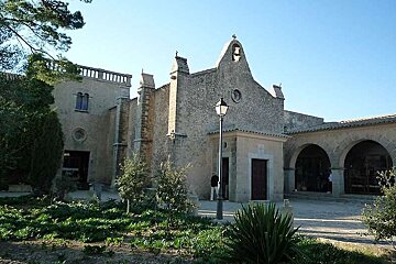 a photo of an old church on a hill