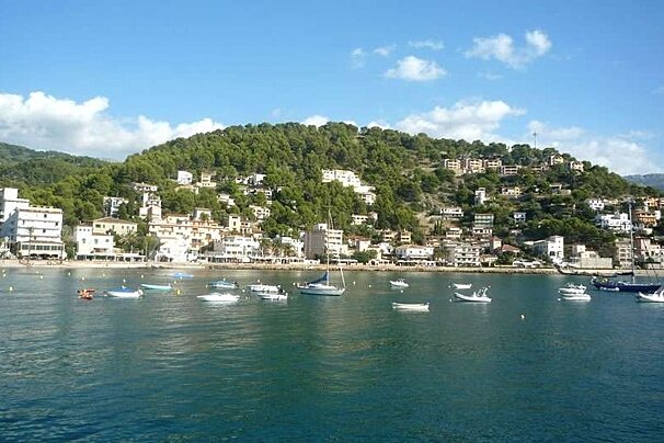 a photo of the sea and hills in port soller