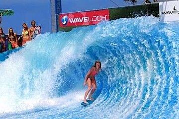 Picture of girl surfing artificial wave