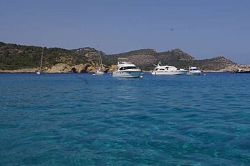 beautiful water and boats infront of island