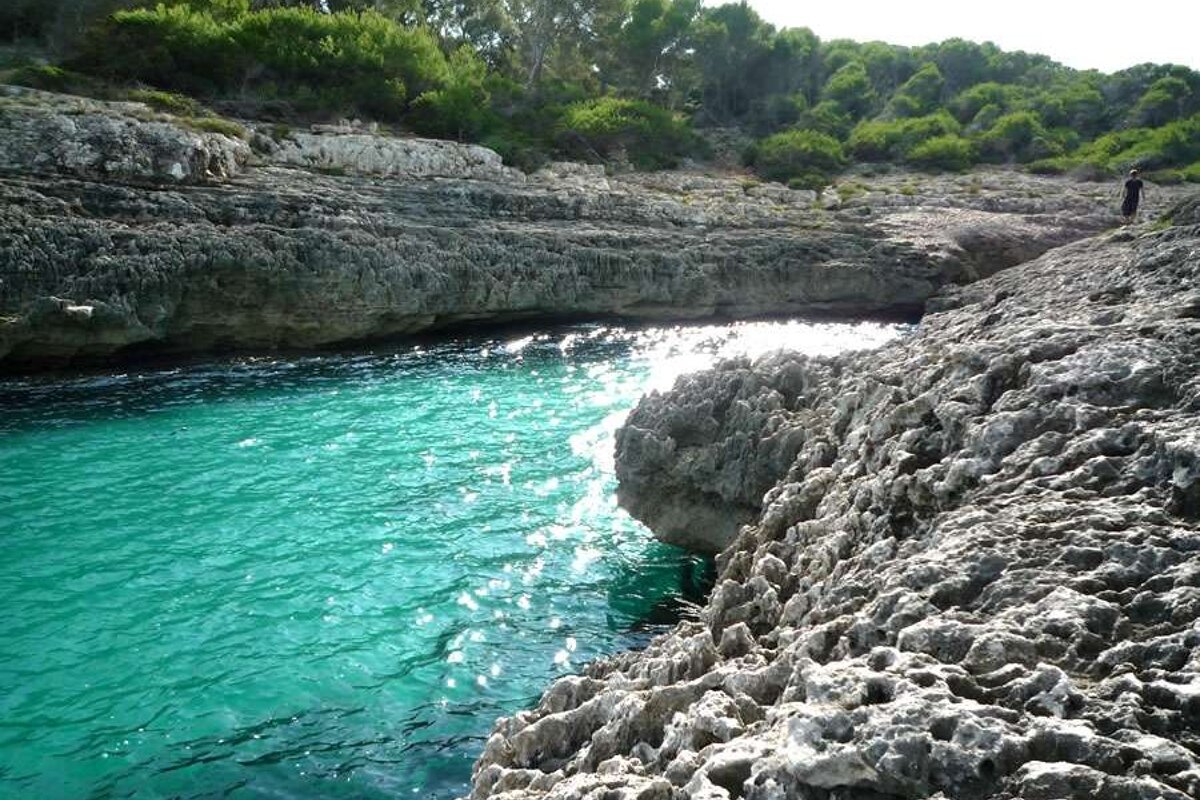 a photo of the turquoise sea in mondrago majorca