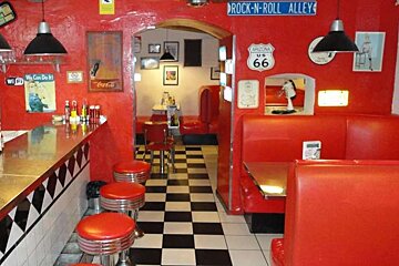 Restaurant with red seats and chequered floor