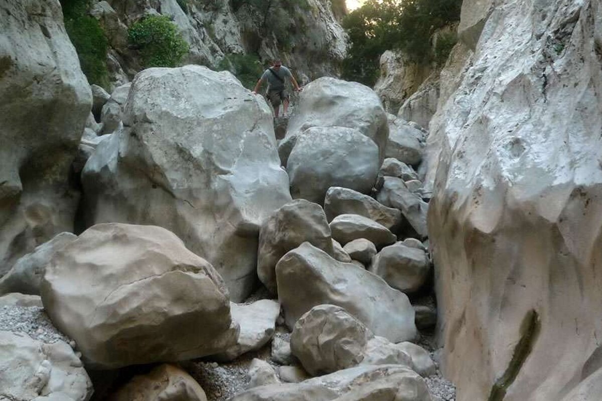 a photo of large rocks in a gorge in majorca