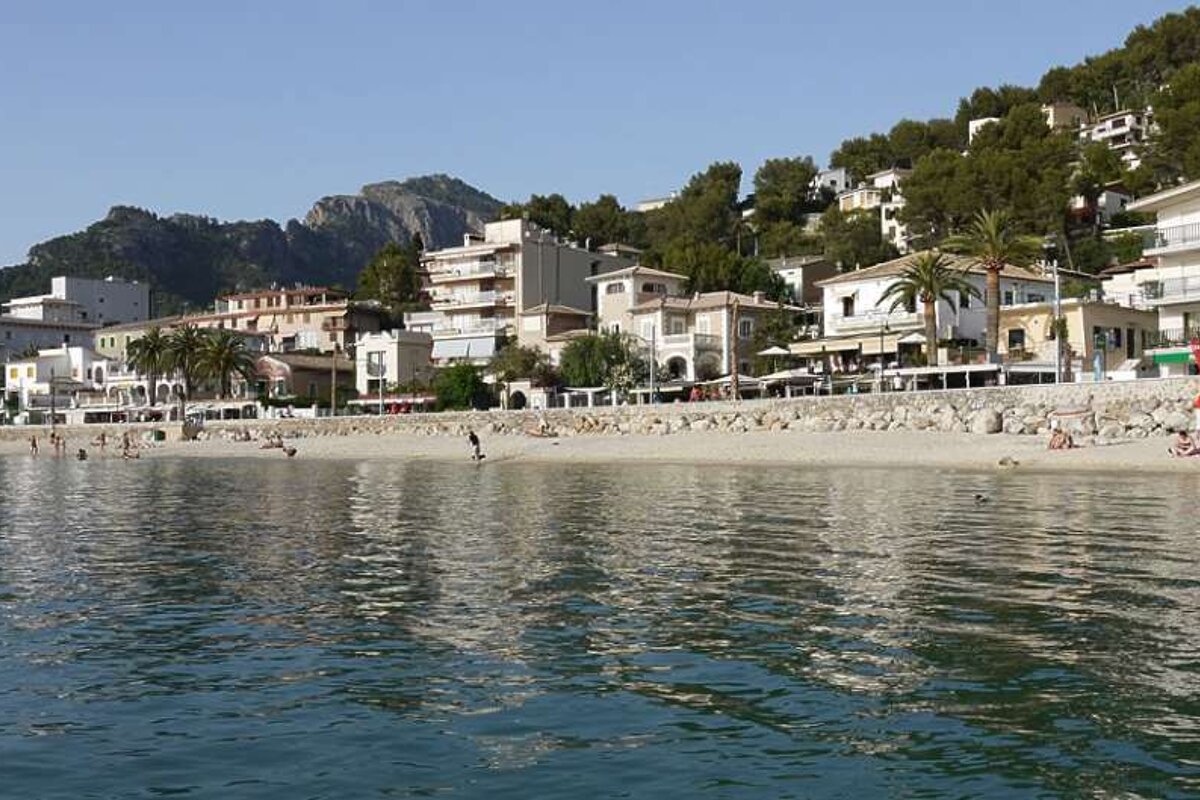 photo of sea, beach, town and hills