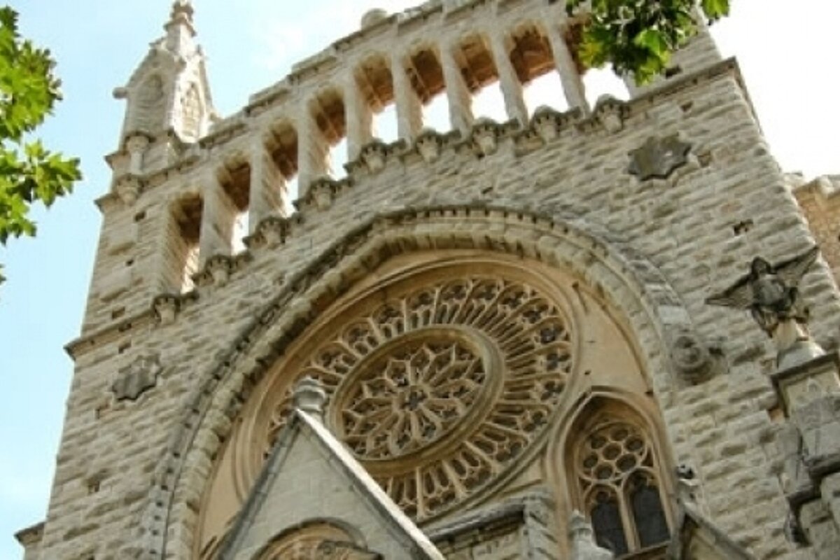 A large brick building with a circular window on the front
