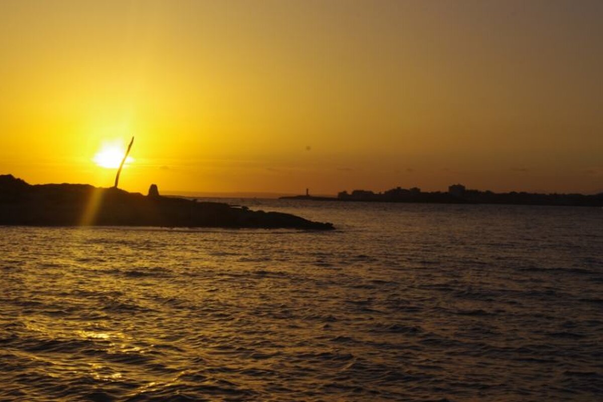 sunsetting with islands in the foreground
