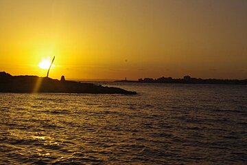 sunsetting with islands in the foreground