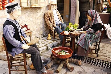 a photo of traditional stuffed puppets at a majorcan fair