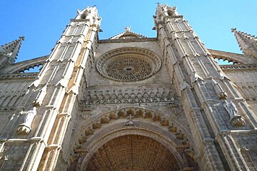 a photo of the front facade of palma cathedral in majorca