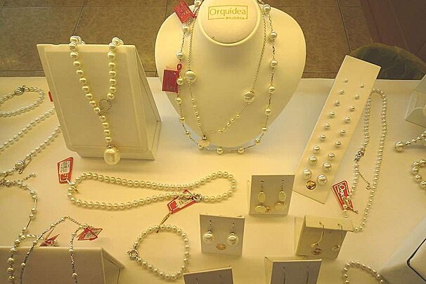 a photo of a display cabinet of artificial pearls from majorca