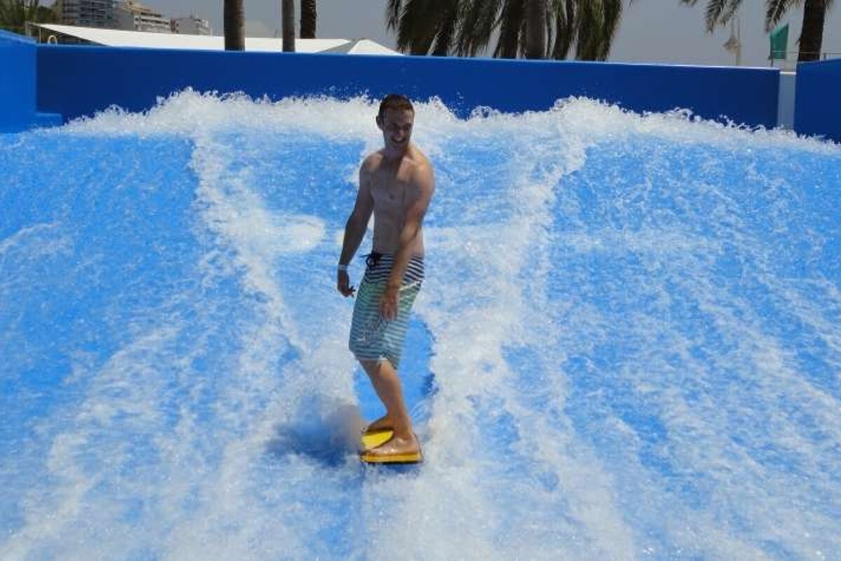 guy smiling on surf machine