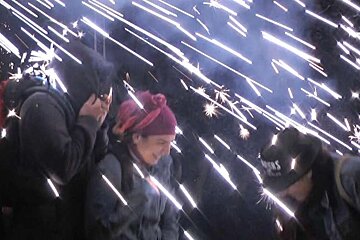 people sheltering from sparks