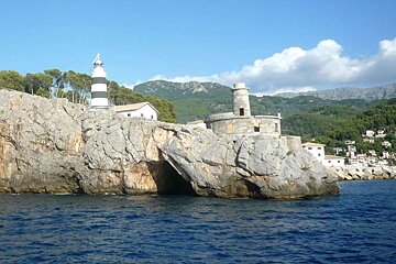 a photo of the lighhouse and rocks and seas at soller majorca