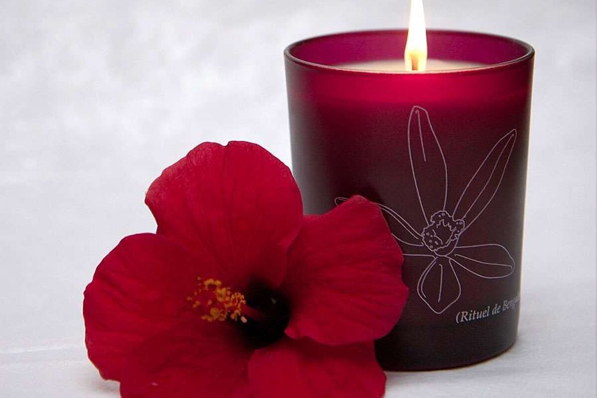 a photo of a flower and a candle at a mallorca spa