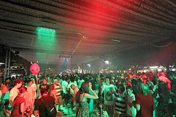 photo of people dancing at night