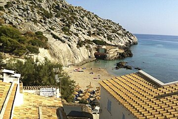 photo of a beach and roof tops