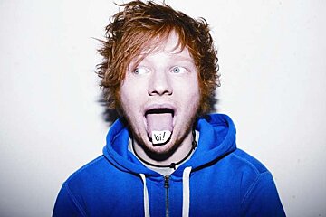 a photo of a man with a blue hoodie