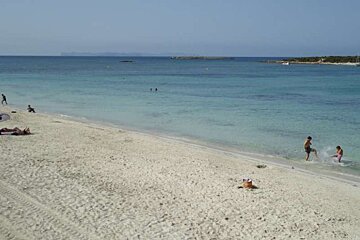 white sand and blue water