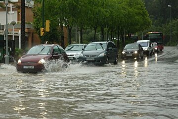 A photo of cars on flooded roads