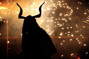 Photo of silouette of devil with sparks