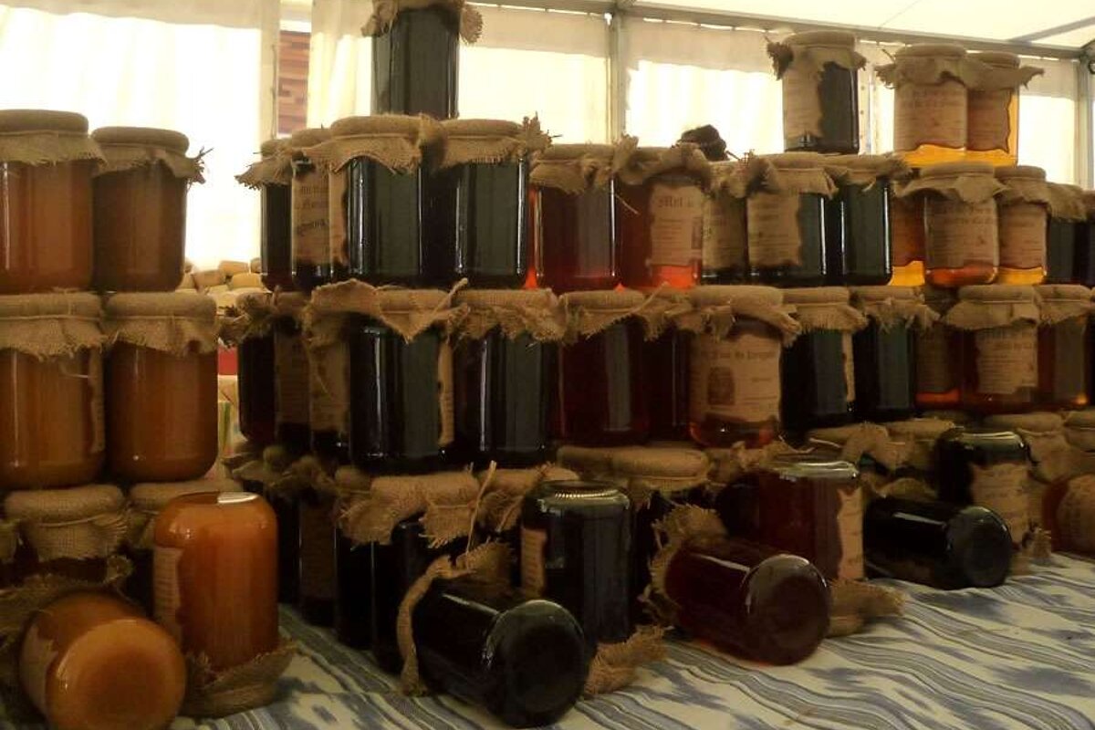 a photo of honey jars in a market alcudia majorca